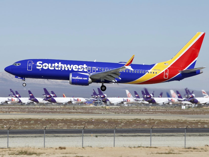caption: A Southwest Airlines Boeing 737 Max lands in Victorville, Calif., in March.