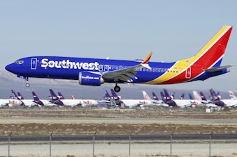 caption: A Southwest Airlines Boeing 737 Max lands in Victorville, Calif., in March.
