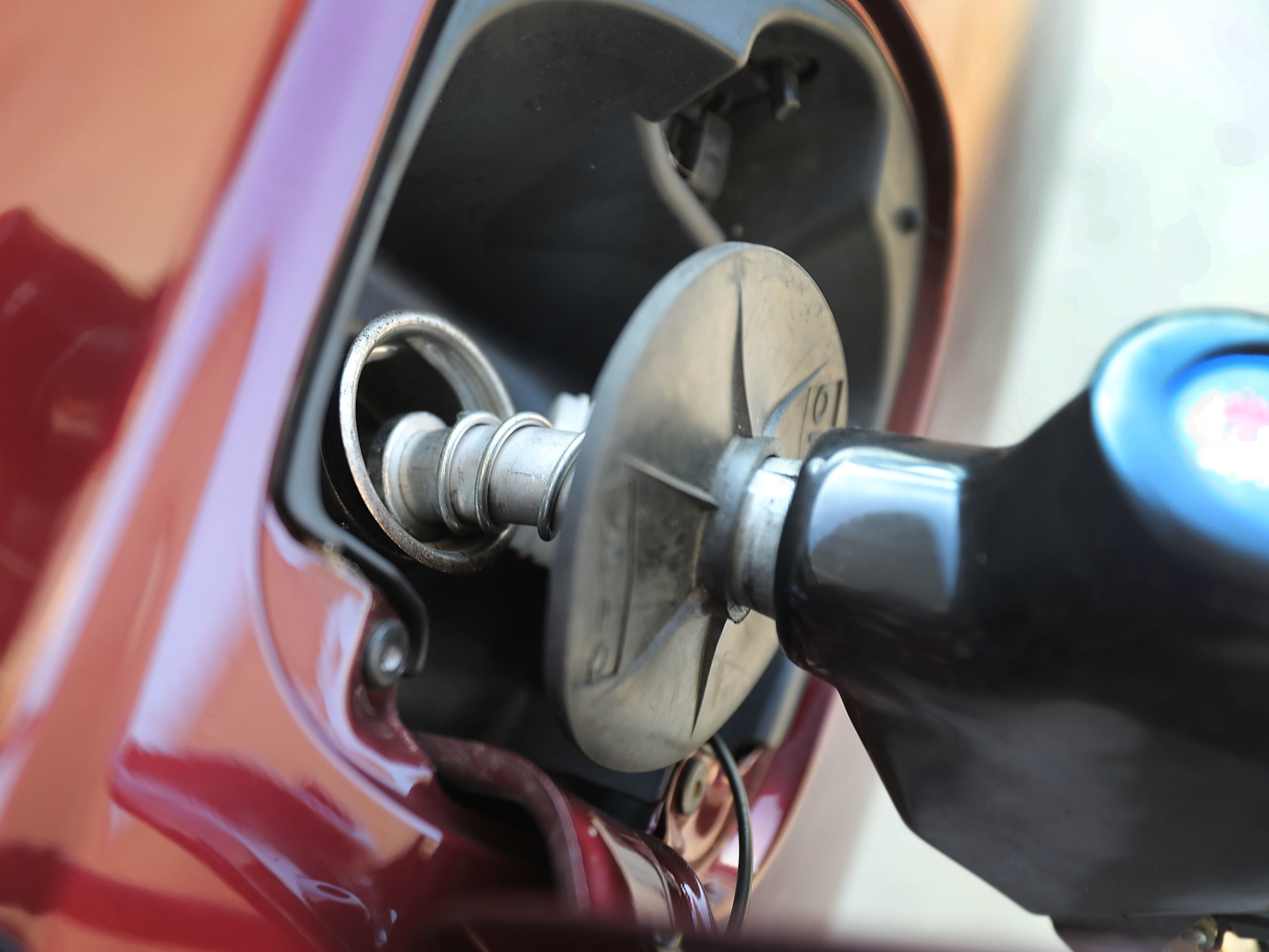 caption: Gas prices have fallen markedly, and may continue to dip further, according to AAA.