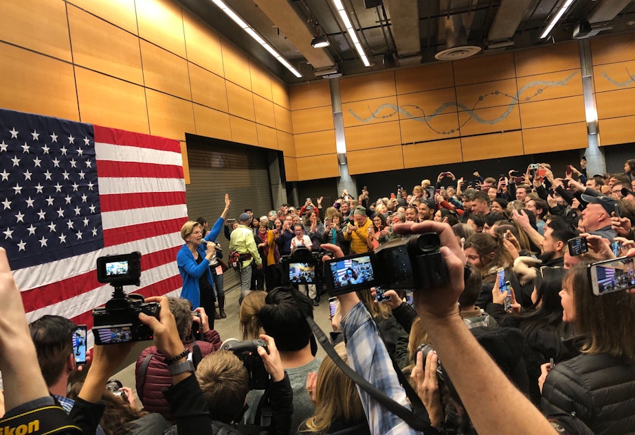 caption: Elizabeth Warren greeted supporters at Fisher Pavilion before speaking at the Seattle Center Armory.