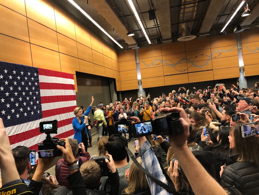 caption: Elizabeth Warren greeted supporters at Fisher Pavilion before speaking at the Seattle Center Armory.