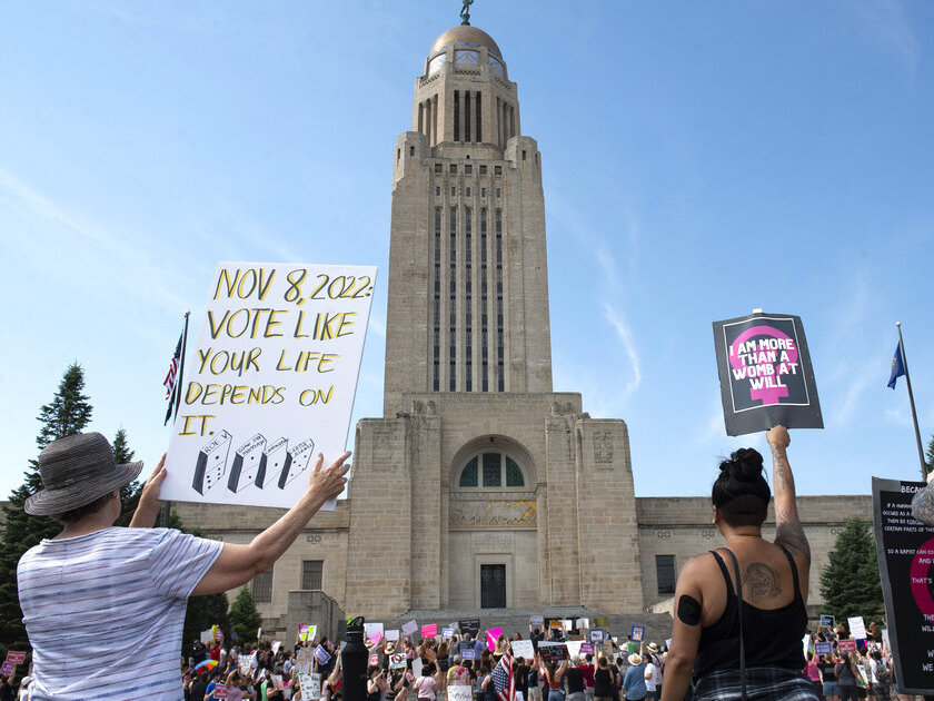 caption: Protesters line the street June 4 around the front of the Nebraska State Capitol during an Abortion Rights Rally in Lincoln, Neb.