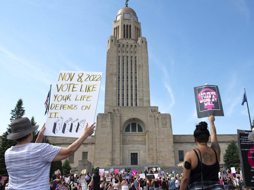 caption: Protesters line the street June 4 around the front of the Nebraska State Capitol during an Abortion Rights Rally in Lincoln, Neb.