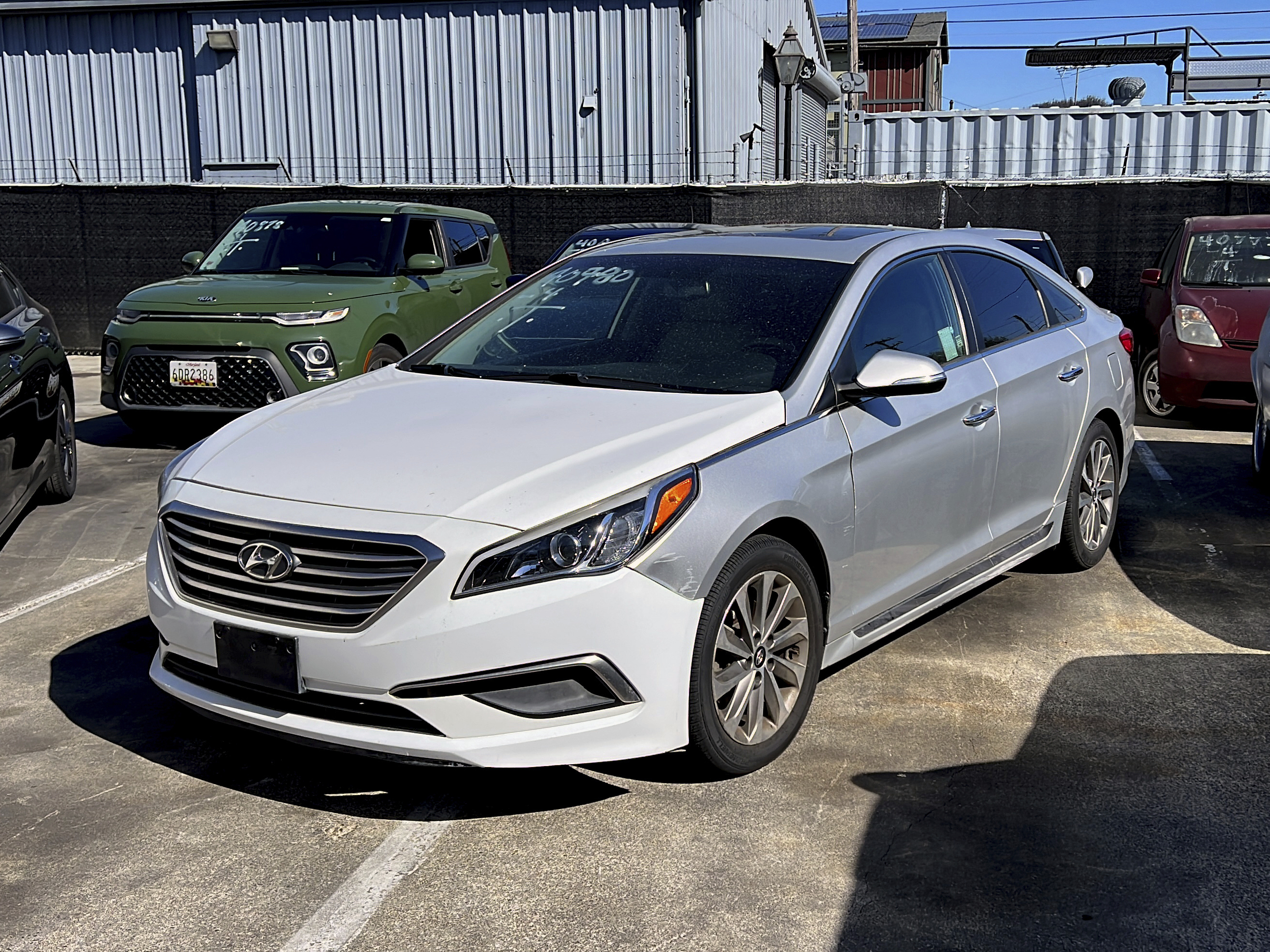 caption: A Hyundai sedan sits in the parking lot of East Bay Tow Inc., where California Attorney General Rob Bonta held a news conference on Thursday.