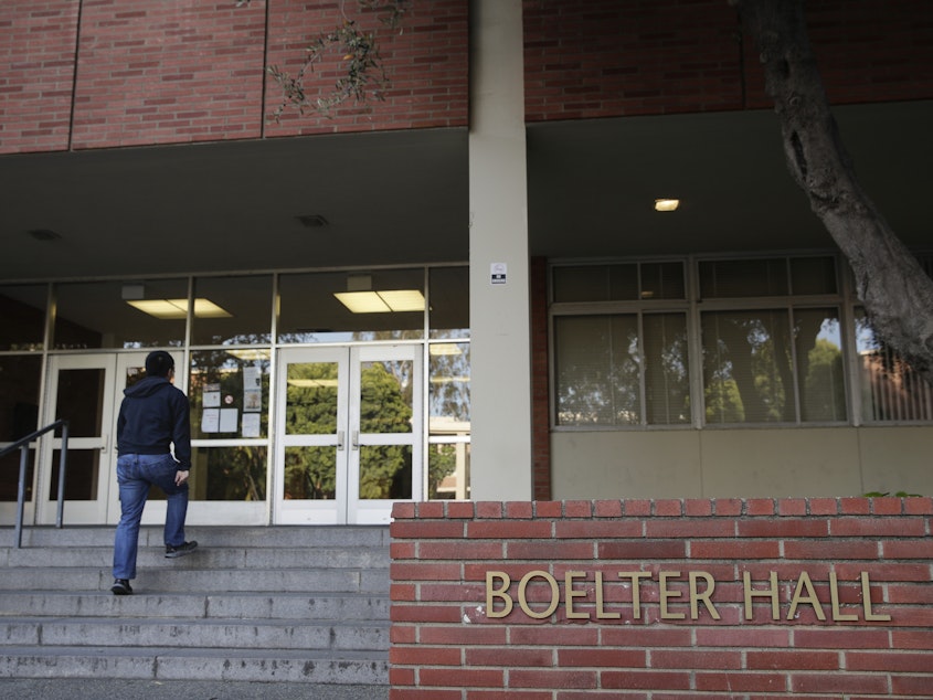 caption: A student enters Boelter Hall at University of California, Los Angeles on Thursday. Hundreds of students and staff at two Los Angeles universities, including UCLA, have been placed under quarantine because they may have been exposed to measles and either have not been vaccinated or cannot verify that they are immune, officials said Thursday.
