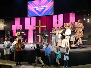 caption: The choir at Meadowridge Baptist church in Fort Worth, Texas, performs at a worship service in October 2019.