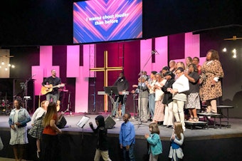caption: The choir at Meadowridge Baptist church in Fort Worth, Texas, performs at a worship service in October 2019.