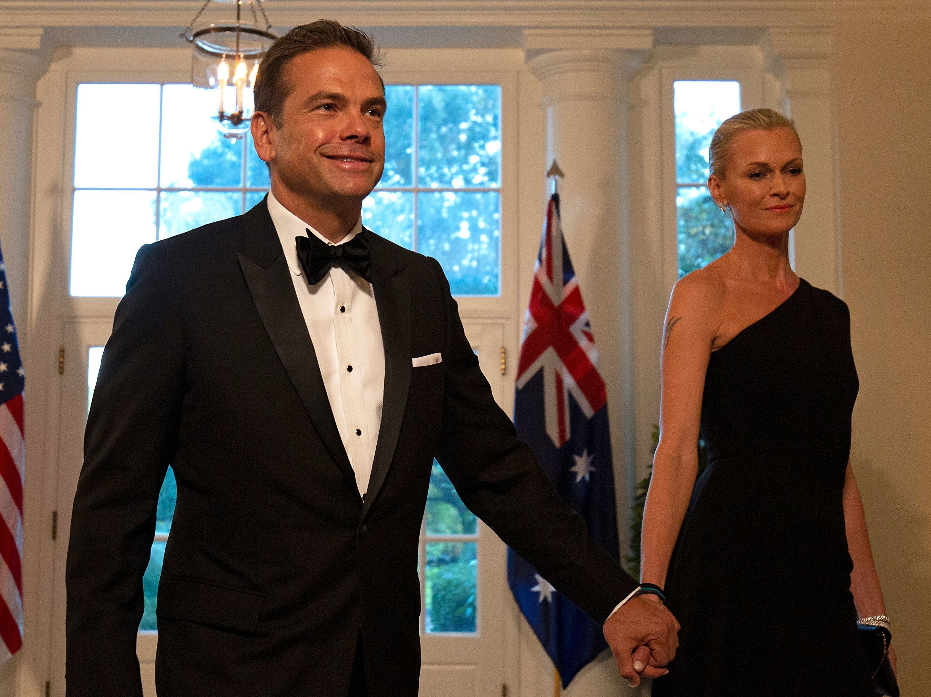 caption: Fox Corp.'s Lachlan Murdoch and his wife, Sarah, arrive at the White House for a 2019 state dinner honoring Australian Prime Minister Scott Morrison. Murdoch and his family reportedly are moving to Sydney from Los Angeles.