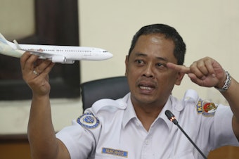 caption: Nurcahyo Utomo, an investigator for Indonesia's National Transportation Safety Committee, speaks at a news conference in Jakarta, Indonesia, on Wednesday, about preliminary findings from the investigation into the crash of Lion Air Flight 610.