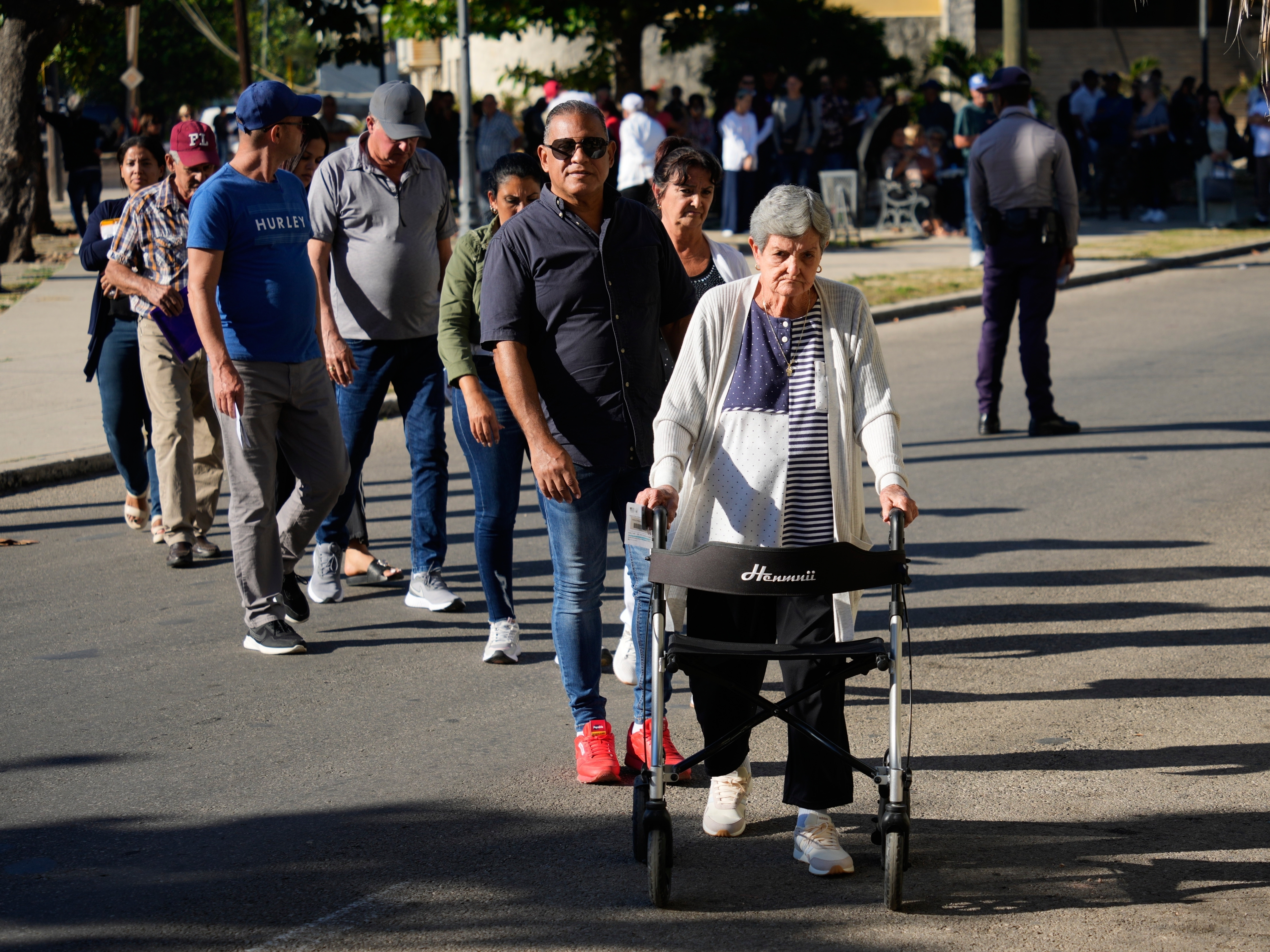 caption: Cubans line up for appointments at the U.S. embassy in Havana, Cuba, on Jan. 8.