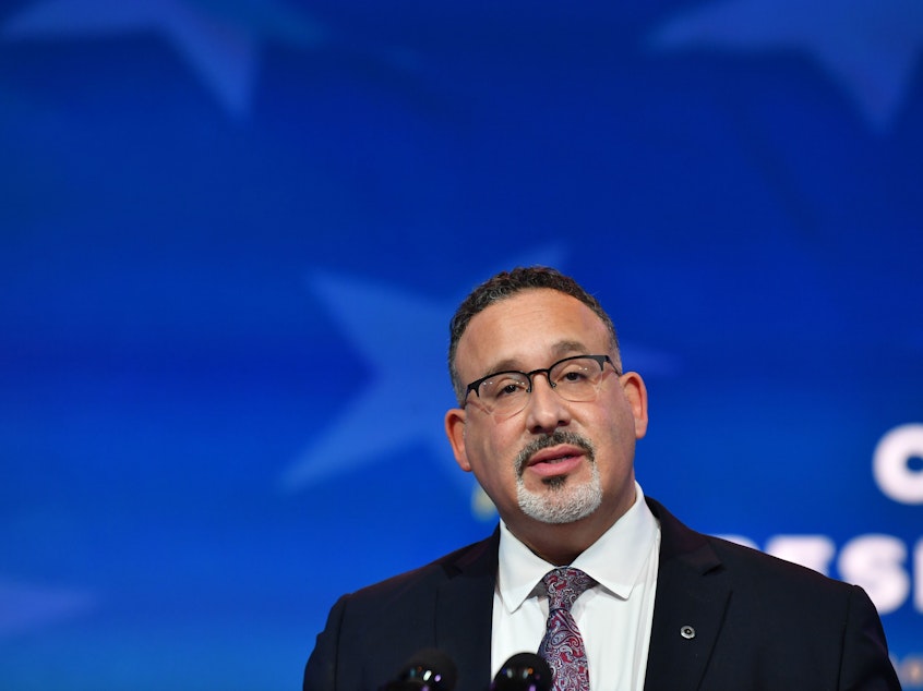 caption: Miguel Cardona, President Biden's nominee for U.S. education secretary, speaks during a December event announcing his nomination.