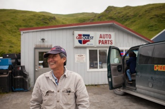 caption: Sonny Nguyen outside of the auto parts store he owns in the town of Unalaska on the port of Dutch Harbor. He's a refugee from Vietnam who moved to Seattle in 1976 and then went to Dutch Harbor where he's lived on and off for 30 years. 