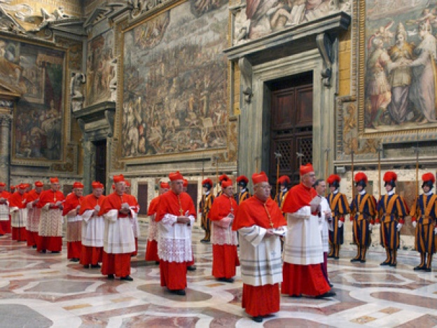 caption: In this photo from files taken on April 18, 2005, and released by the Vatican paper <em>L'Osservatore Romano</em>, Cardinals walk in procession to the Sistine Chapel at the Vatican, at the beginning of the conclave.