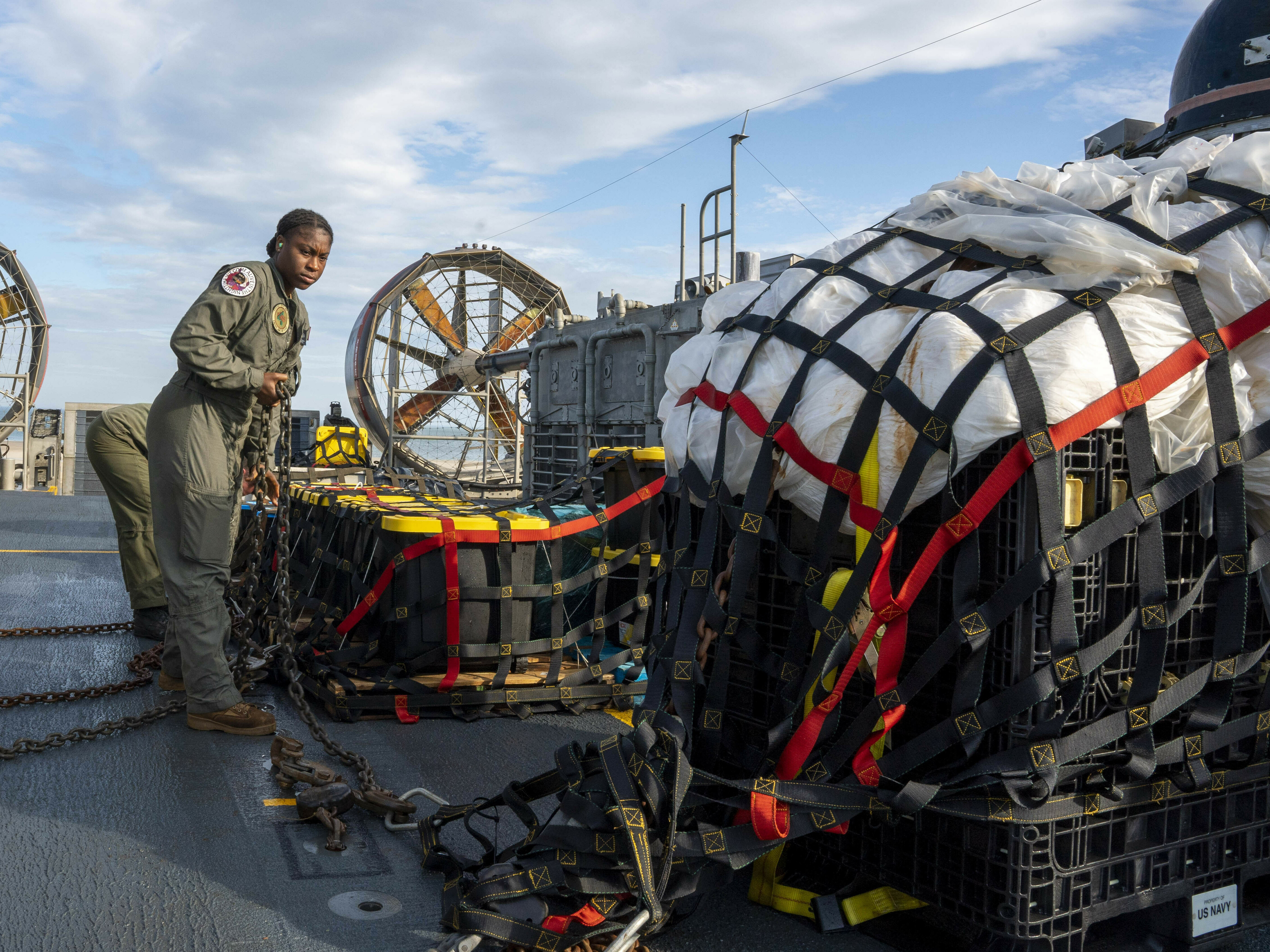 caption: Sailors prepare material recovered in the Atlantic Ocean from a high-altitude balloon Friday for transport. The U.S. military says it has succeeded in recovering "significant debris" from a Chinese balloon that was shot down off of the South Carolina coast.