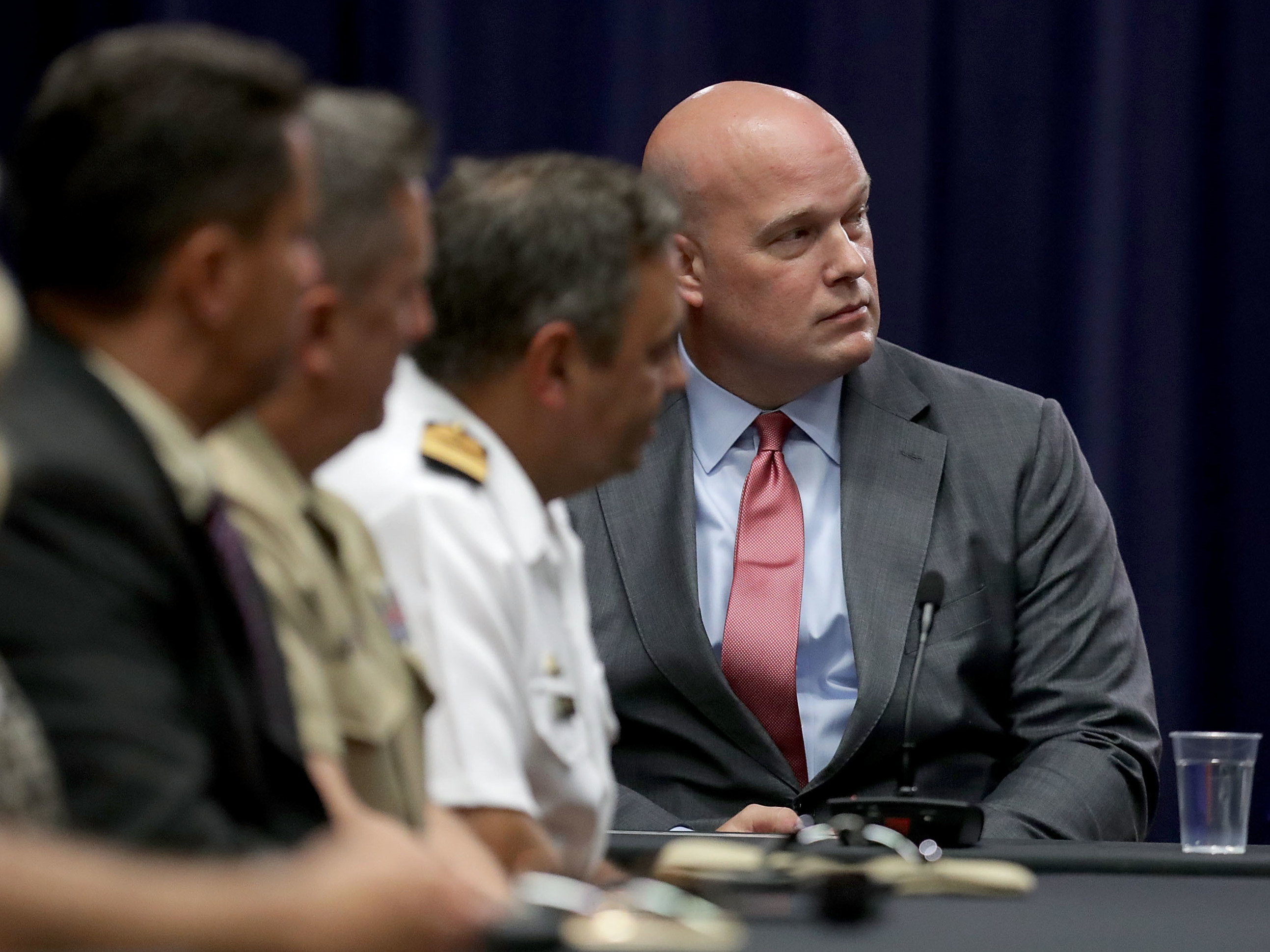 caption: Matt Whitaker participates in a round table event at the Department of Justice on Aug. 29, 2018 in Washington, D.C.