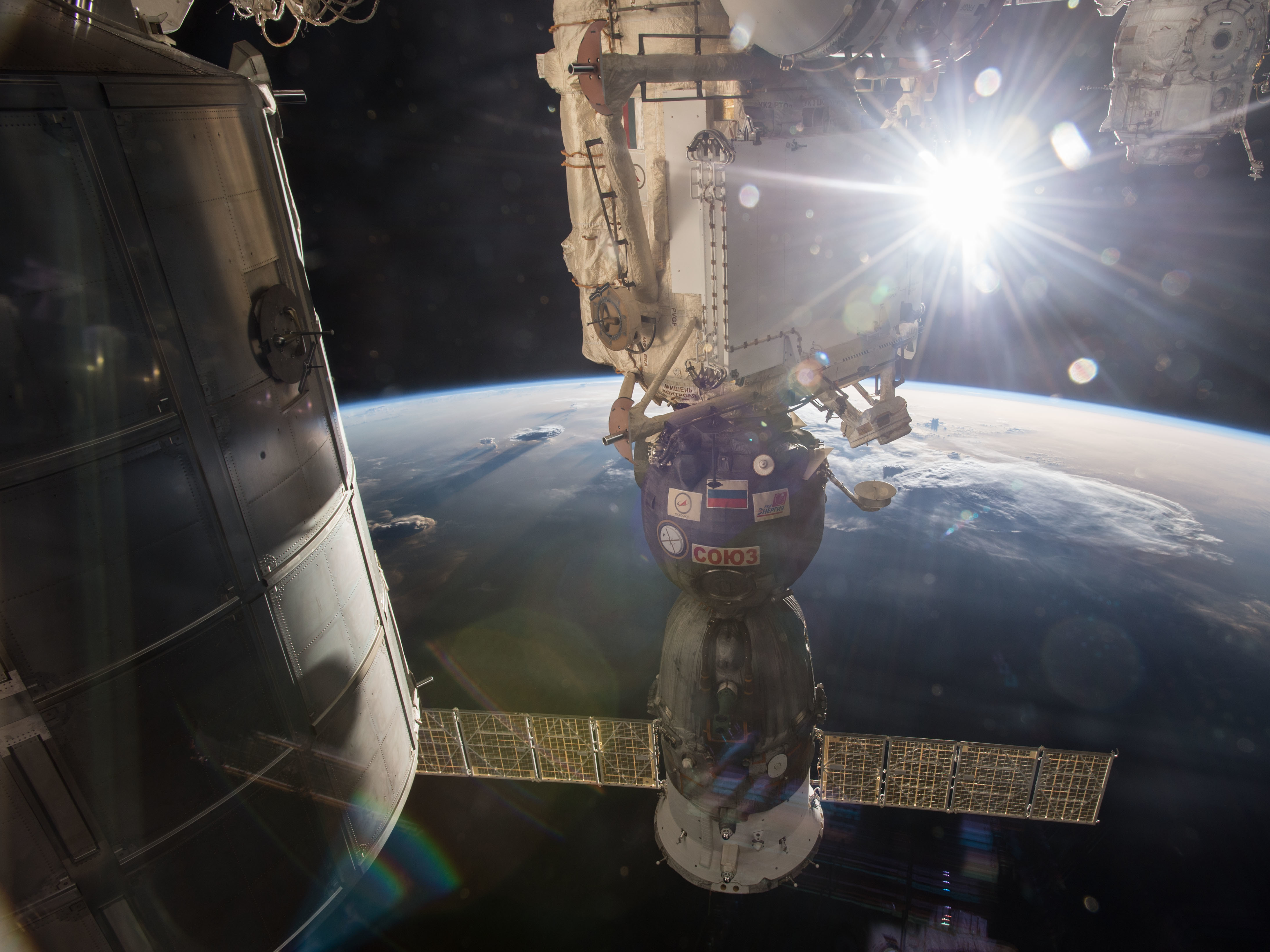 caption: A Soyuz spacecraft docked to the International Space Station in April 2014.