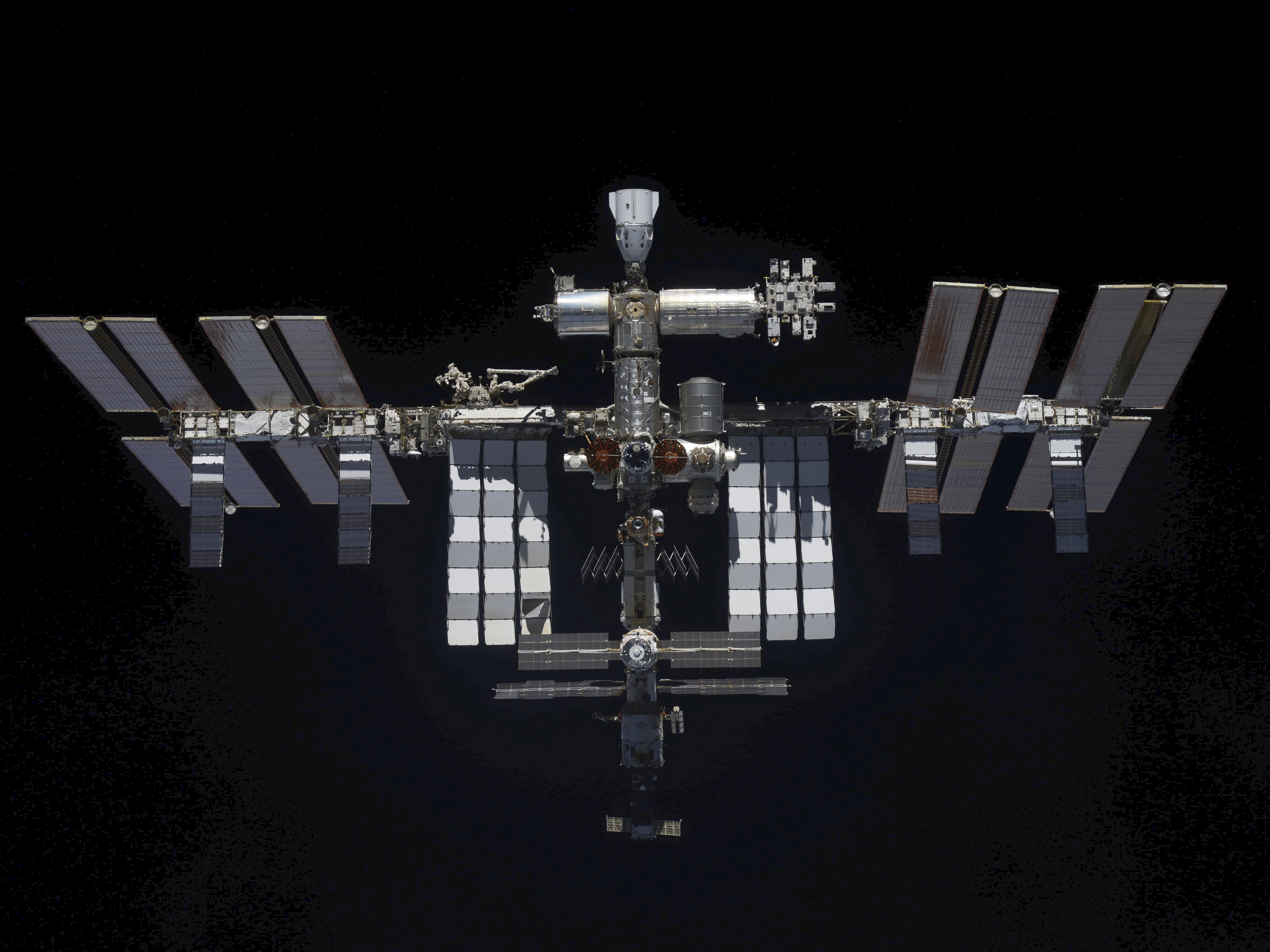 caption: In this handout photo released by Roscosmos Space Agency Press Service, a view of the International Space Station taken on Mar. 30, 2022 by crew of Russian Soyuz MS-19 space ship after undocking from the Station.
