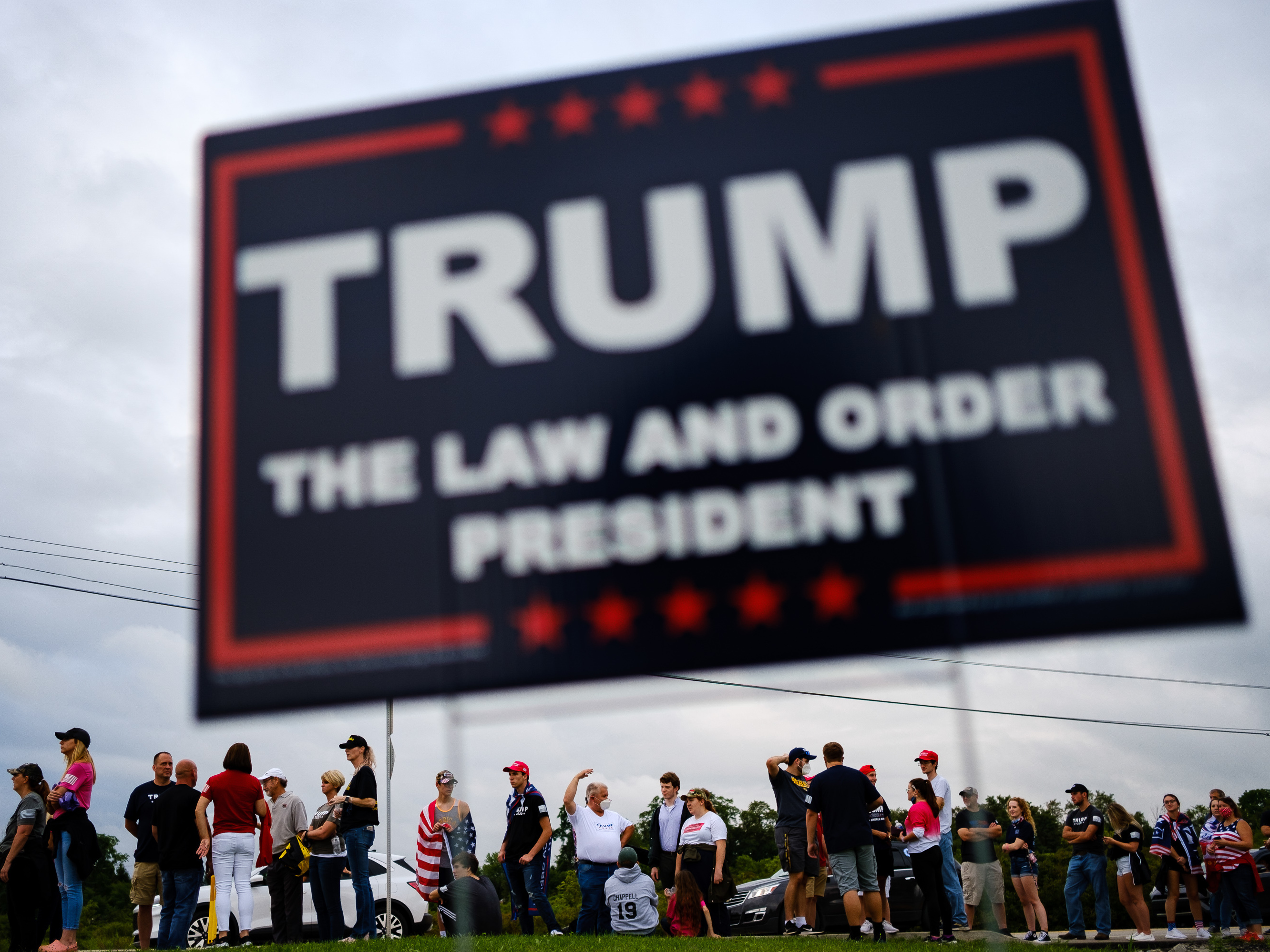 caption: Supporters of President Trump line up outside of Arnold Palmer Regional Airport to get into a Sept. 3 rally in Latrobe, Pa.