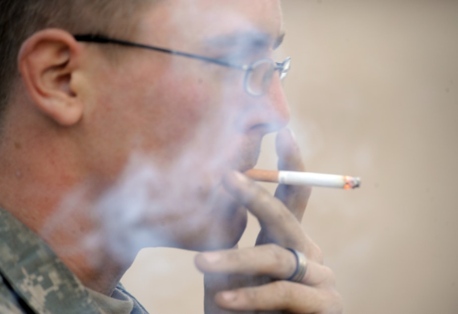 U.S. Army Pfc. Dustin Hein smokes a cigarette between training missions at the National Training Center at Fort Irwin, California in November 2009.