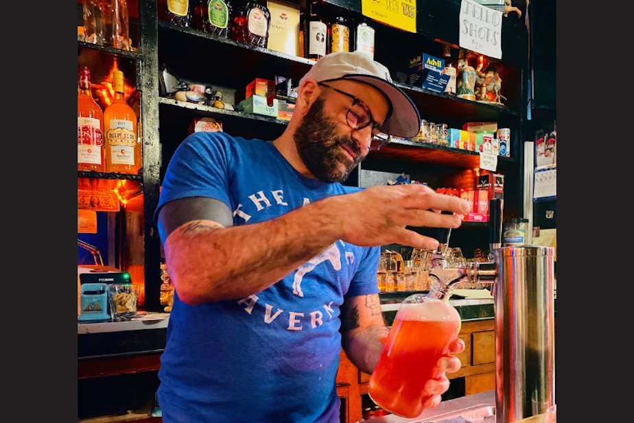 caption: Sam Halhuli makes a drink at Mule Tavern, a craft bar in South Tacoma.