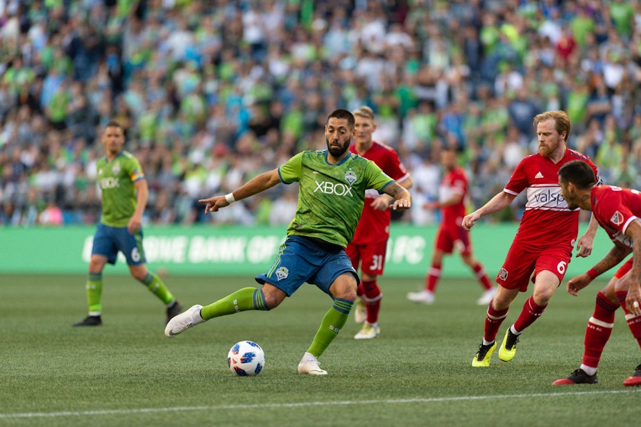 caption: Seattle Sounders FC forward Clint Dempsey takes a kick against Chicago Fire June 23rd, 2018 at CenturyLink Field.