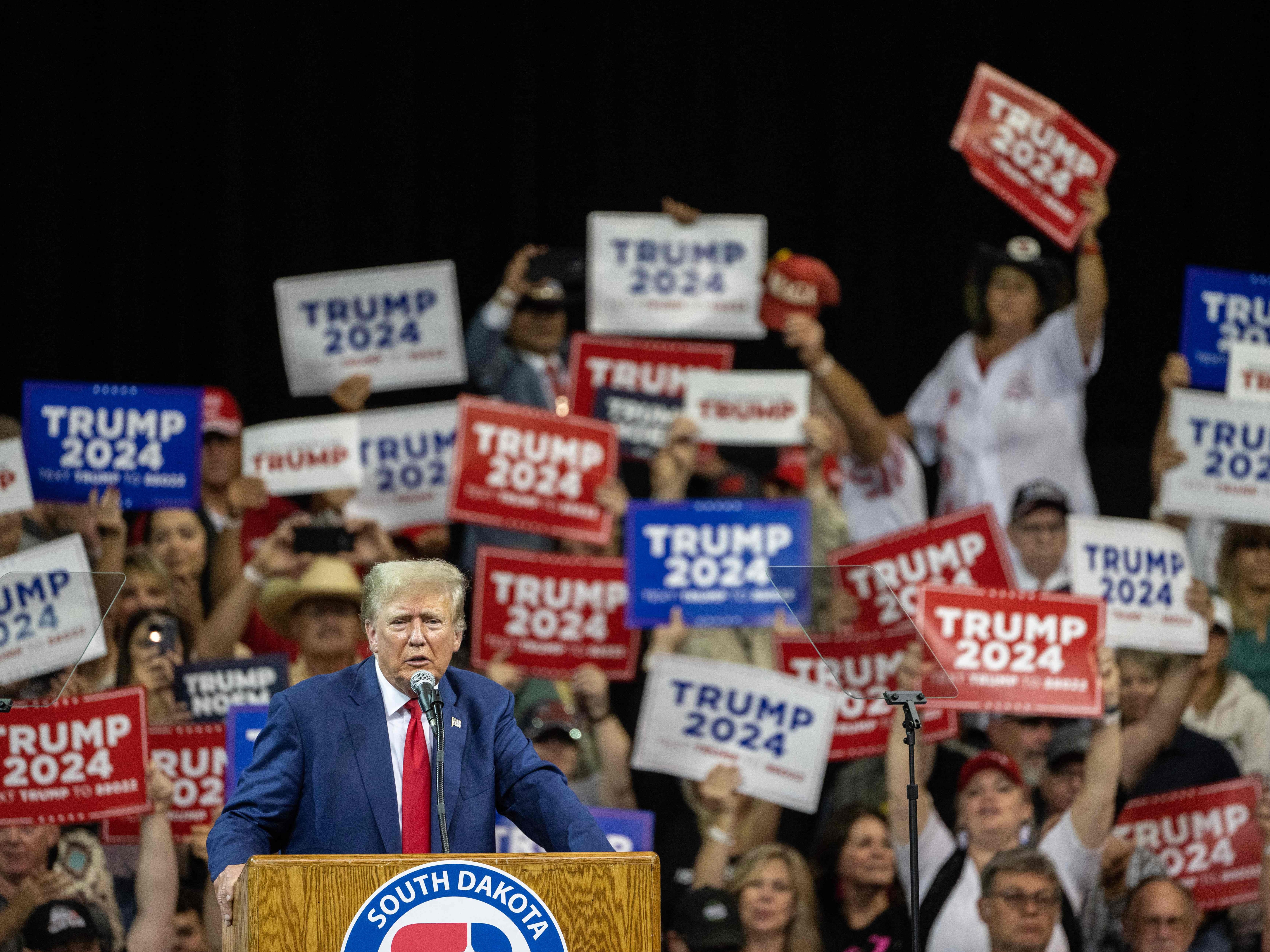 caption: Former President Donald Trump speaks at a campaign rally in Rapid City, S.D., on Sept. 8.
