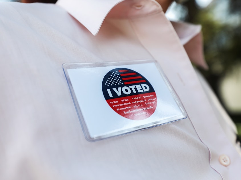 caption: A voter wears an "I Voted" badge after placing a ballot in a drop box in Los Angeles last week. Officials say members of the Republican Party have illegally placed unauthorized drop boxes in some locations.