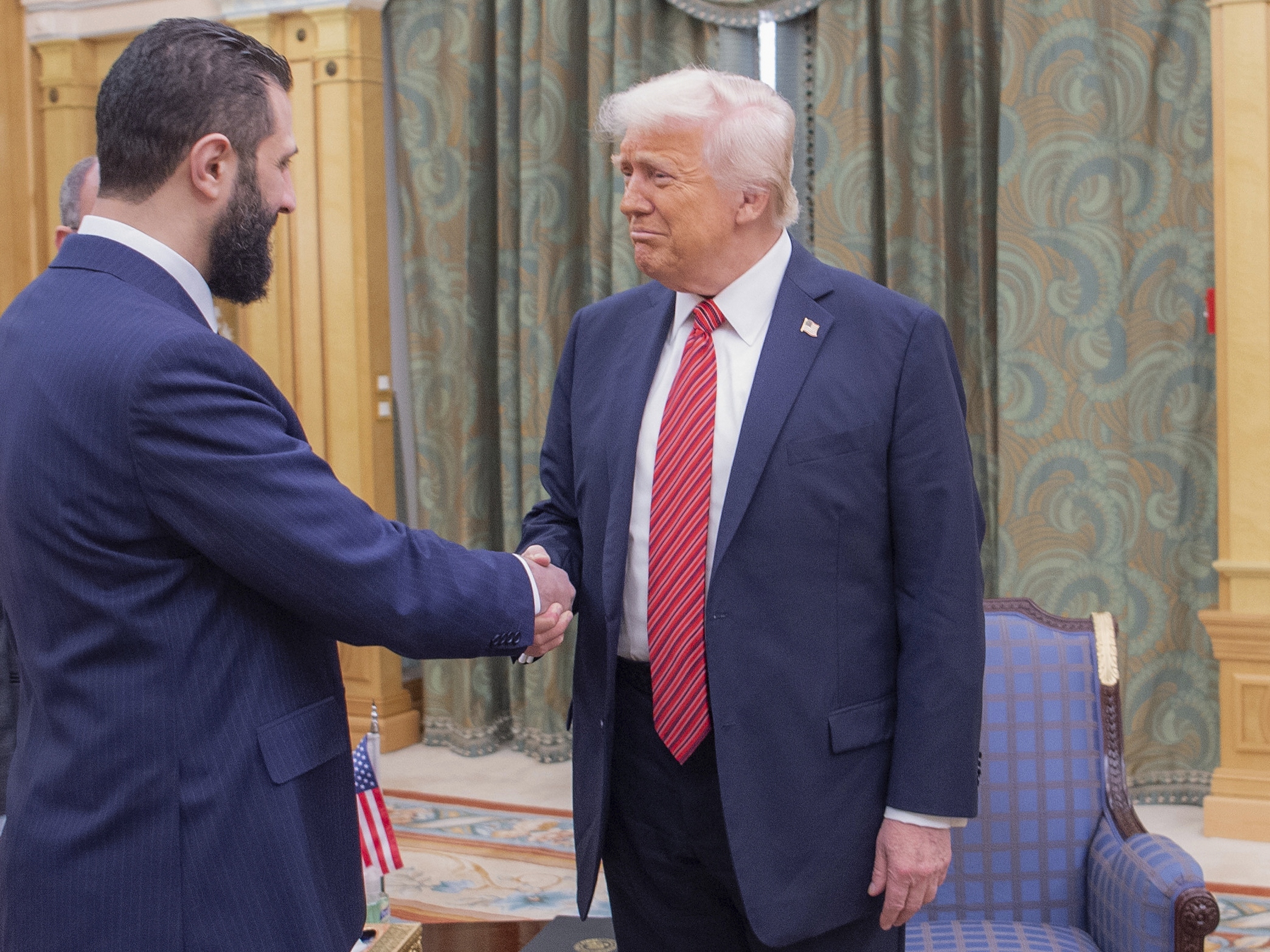 caption: President Trump meets with Syria's interim President Ahmed al-Sharaa on March 14, 2025 in Riyadh, Saudi Arabia.