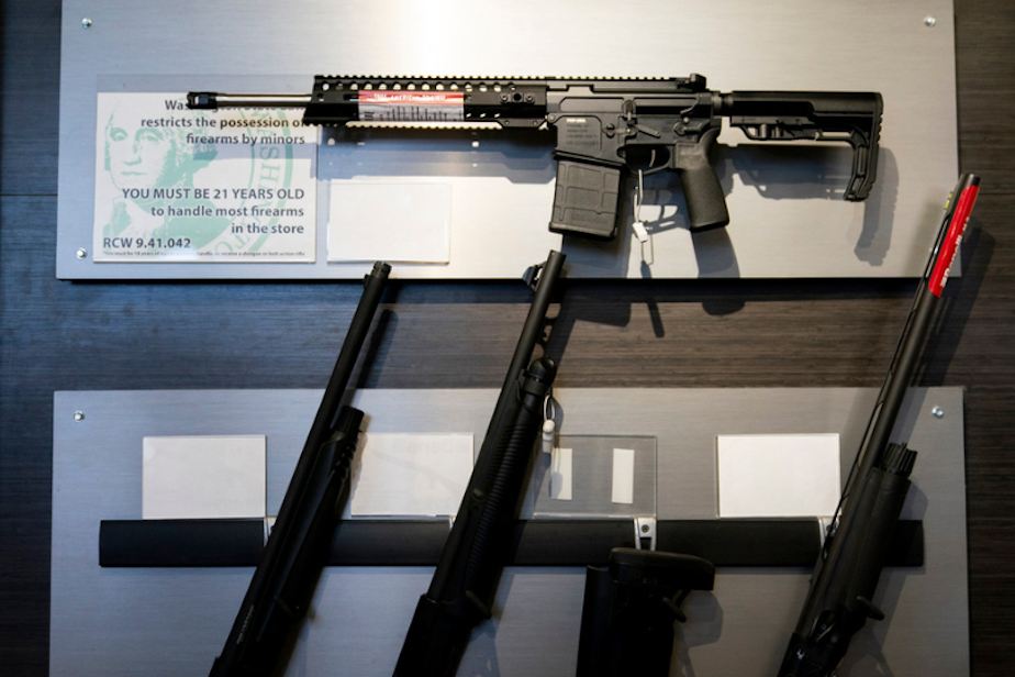 caption: A semi-automatic rifle is displayed above shotguns at Rainier Arms Friday, April 14, 2023, in Auburn, Wash. The pending House Bill 1240 would ban the future sale, manufacture and import of assault-style semi-automatic weapons to Washington State and would go into immediate effect after being signed by Gov. Jay Inslee.