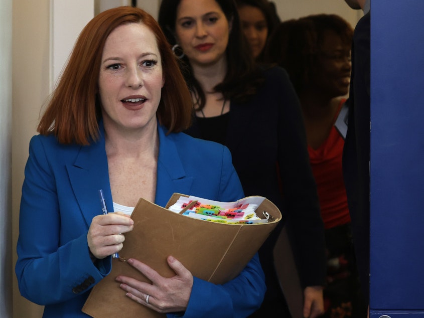 caption: White House Press Secretary Jen Psaki arrives at a White House daily press briefing at the James S. Brady Press Briefing Room of the White House on March 21.