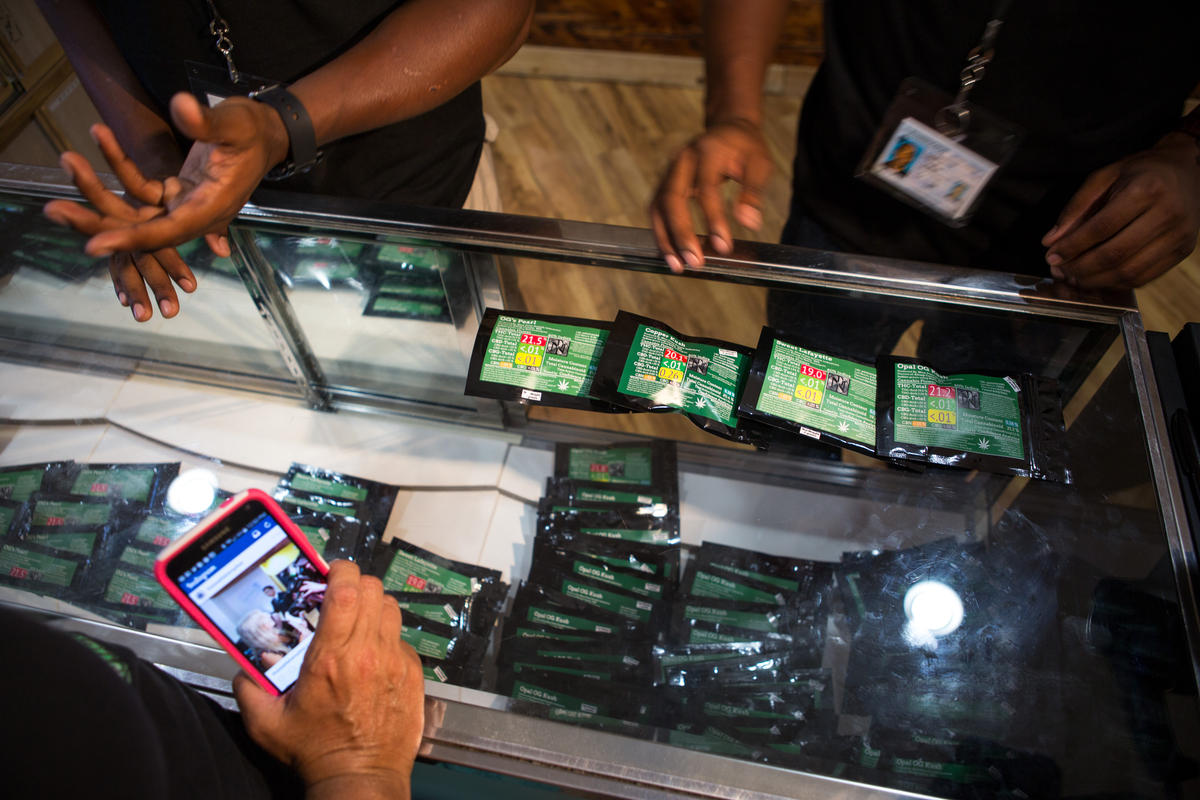 caption: One of the first sales of legal recreational marijuana at Cannabis City in Seattle's Sodo neighborhood on Tuesday afternoon.