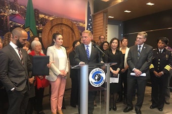 caption: Seattle Mayor Ed Murray announces a lawsuit against the Trump administration on March 29, 2017.
