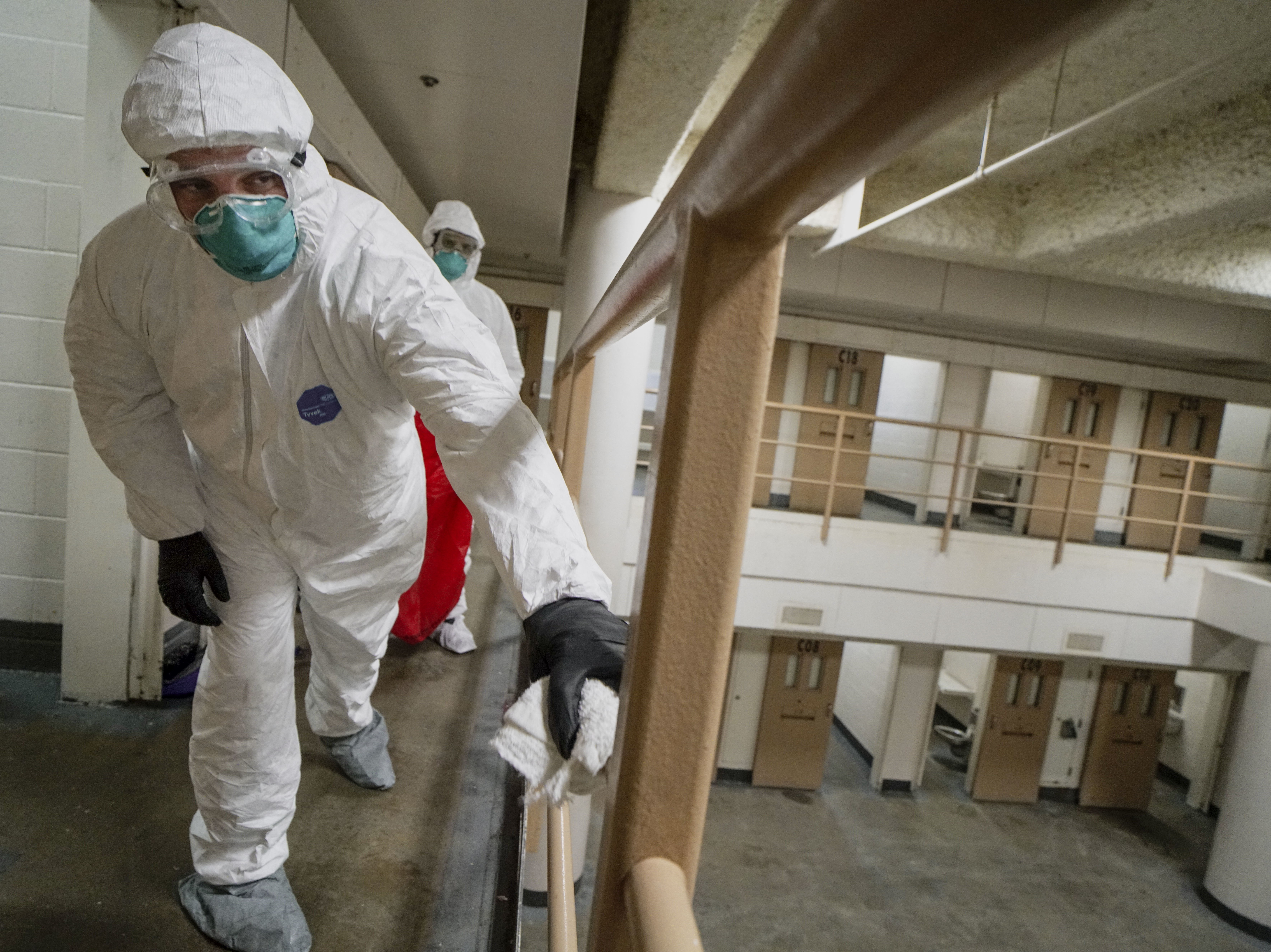 caption: Inmates do a deep cleaning in a cell pod to prevent the spread of COVID-19 at the San Diego County Jail on April 24, 2020. A new study says crowded jails may have contributed to millions of COVID-19 cases across the U.S.