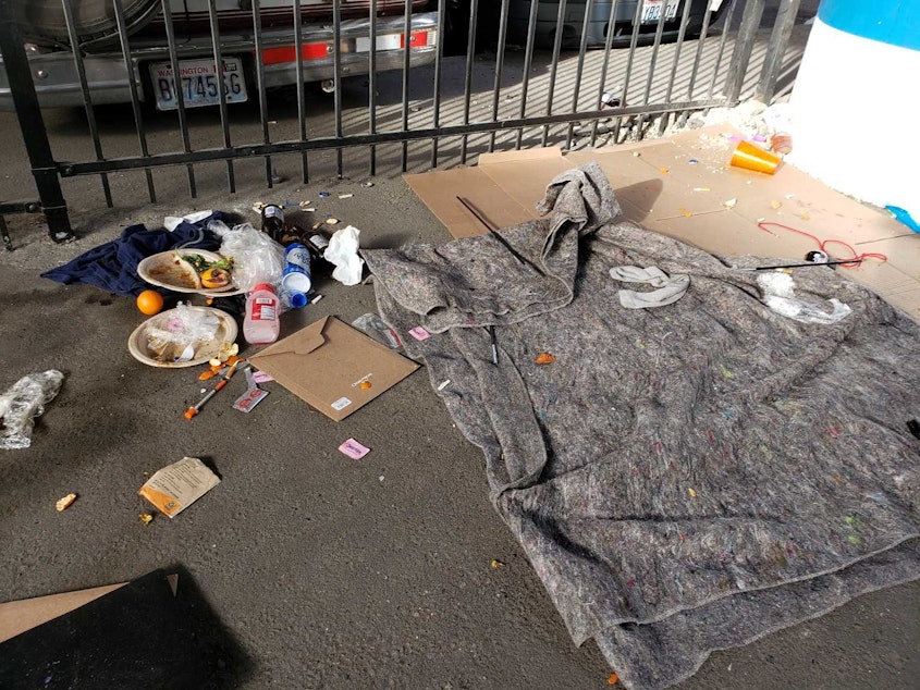 caption: A photo taken under Interstate 5 in the Chinatown-International District that was uploaded to Seattle's Find It, Fix It app under the category "needles" March 15, 2019. 