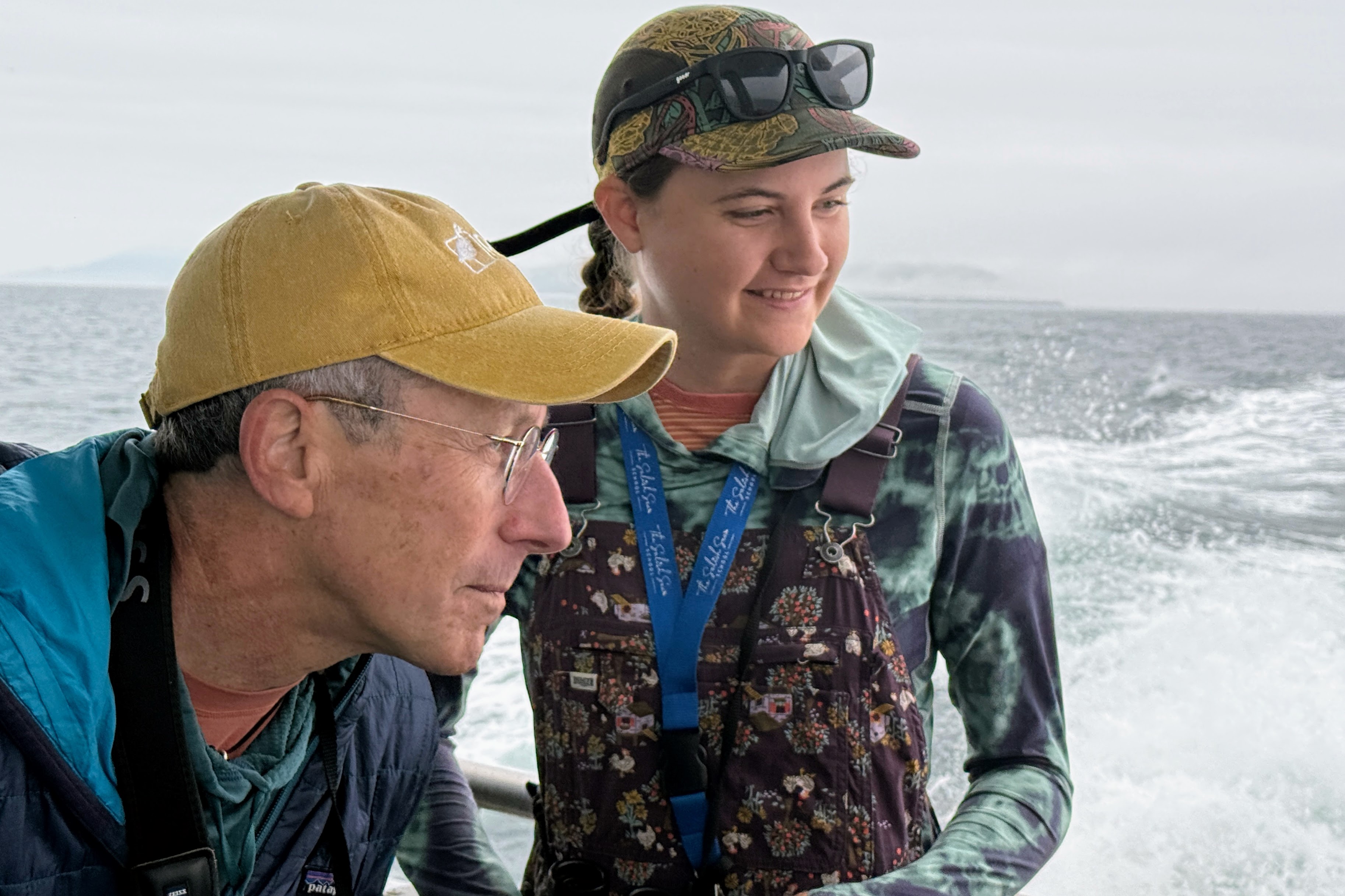 caption: University of Puget Sound seabird biologist Peter Hodum and his former student, Salish Sea School naturalist Olivia Fross ride the Koinonia on Puget Sound on Sept. 6, 2025.