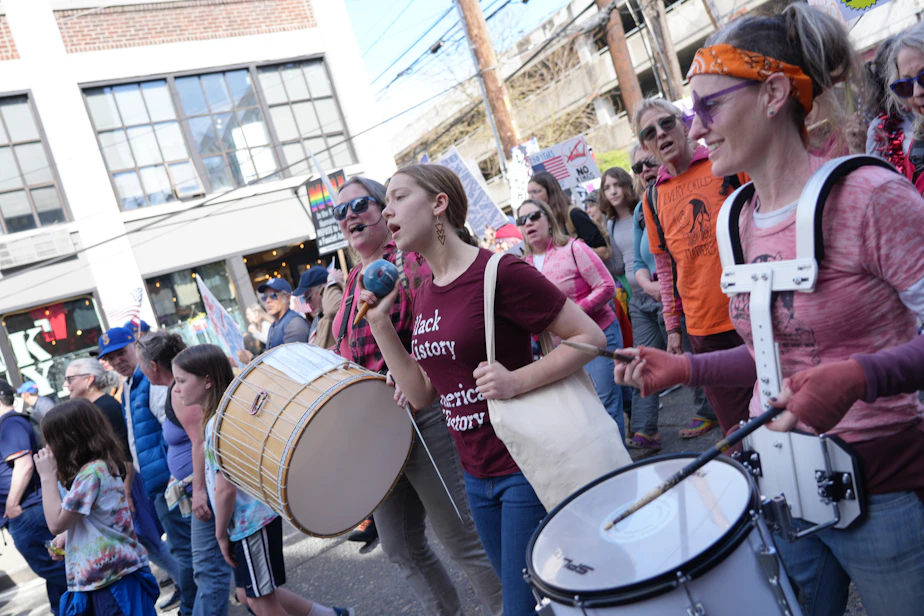 caption: Singing Resistance Seattle members demonstrate on March 28, 2026, at a No Kings protest.