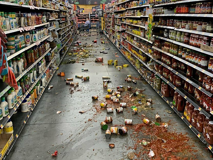 caption: Food that fell from the shelves at a Walmart following an earthquake in Yucca Yalley, Calif., on Friday.