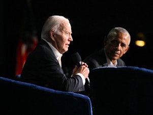 caption: President Biden speaks next to former President Barack Obama onstage during a campaign fundraiser in Los Angeles on June 15,