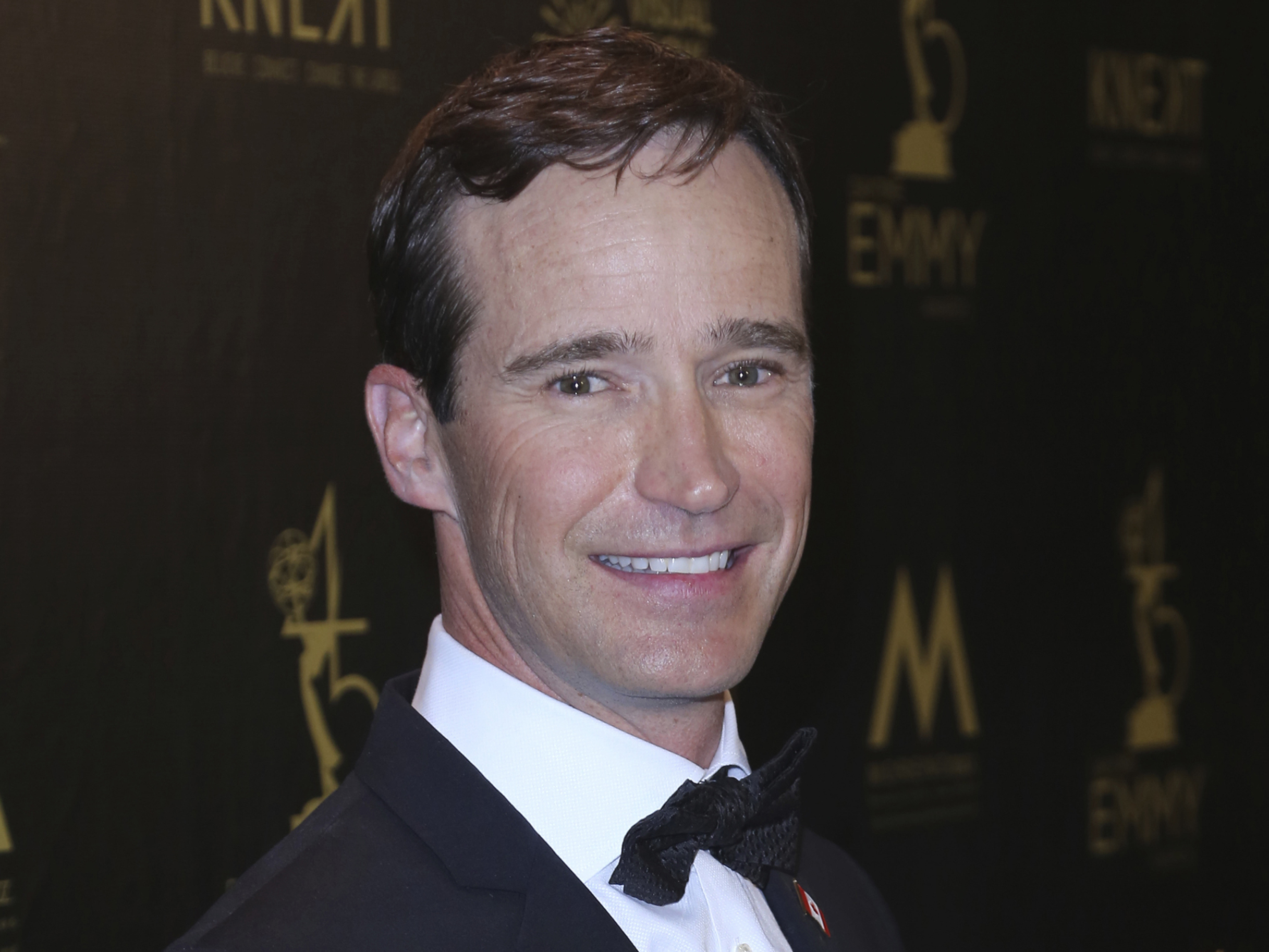 caption: Mike Richards poses in the press room at the 45th annual Daytime Emmy Awards in 2018 in Pasadena, Calif.