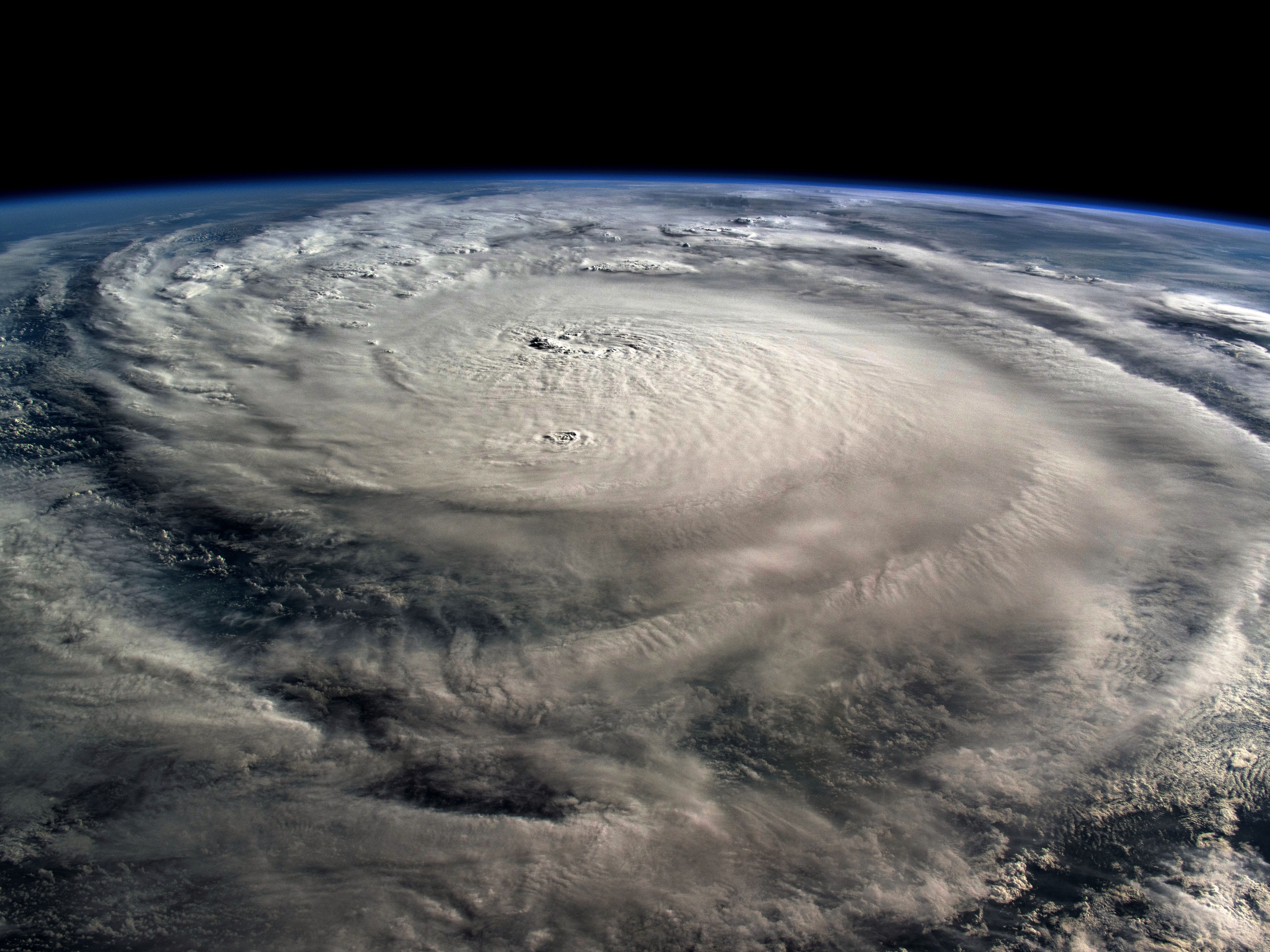 caption: Hurricane Milton, a Category 5 storm at the time of this photograph, is pictured in the Gulf of Mexico off the coast of Yucatan Peninsula on October 8, 2024 seen from the International Space Station as it orbited 257 miles above.