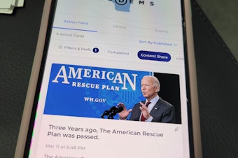 caption: The Reach app, as seen on volunteer Sarah Harrison's phone, allows Biden supporters to share content directly with their contacts, and is connected to a national Democratic party voter database.