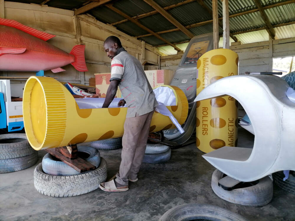caption: A carpenter works on a fantasy coffin, also known as figurative coffins, which are mostly used by locals living in southern Ghana for their religious beliefs about the afterlife. (Kwame Adzaho/Anadolu Agency via Getty Images)
