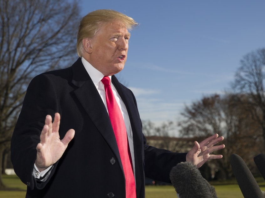 caption: President Trump speaks with reporters outside of the White House after returning from Camp David. His negotiations with Democrats are at an impasse over funding for a border wall.