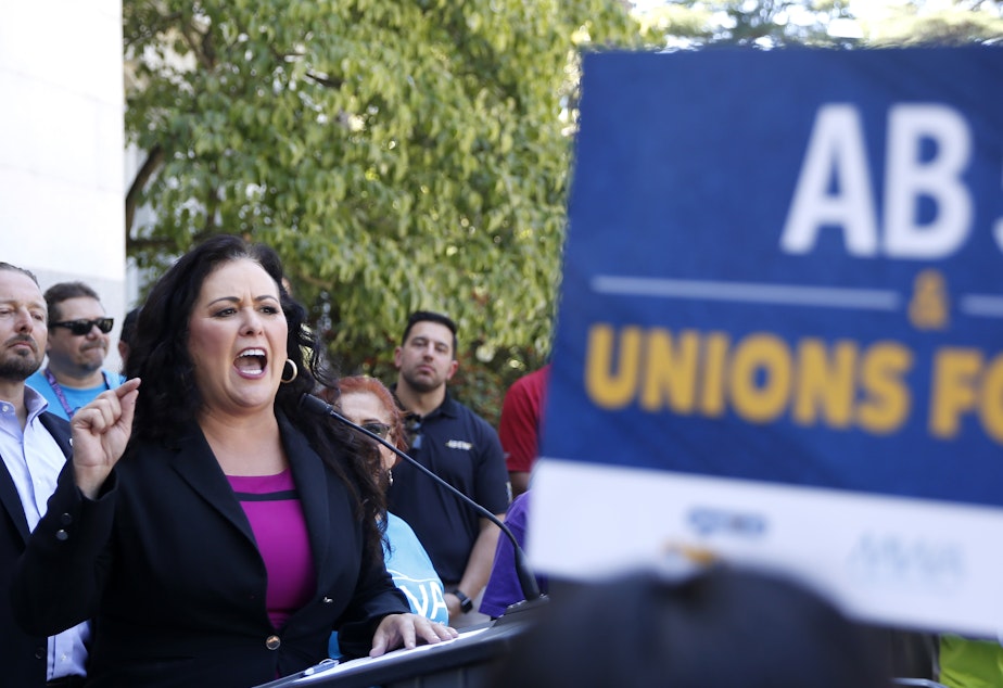 Democratic Assemblywoman Lorena Gonzalez speaks at a July rally for independent contractors in Sacramento, Calif. The measure that passed Tuesday in the state Senate requires companies such as Lyft and Uber to turn many contract workers into employees.