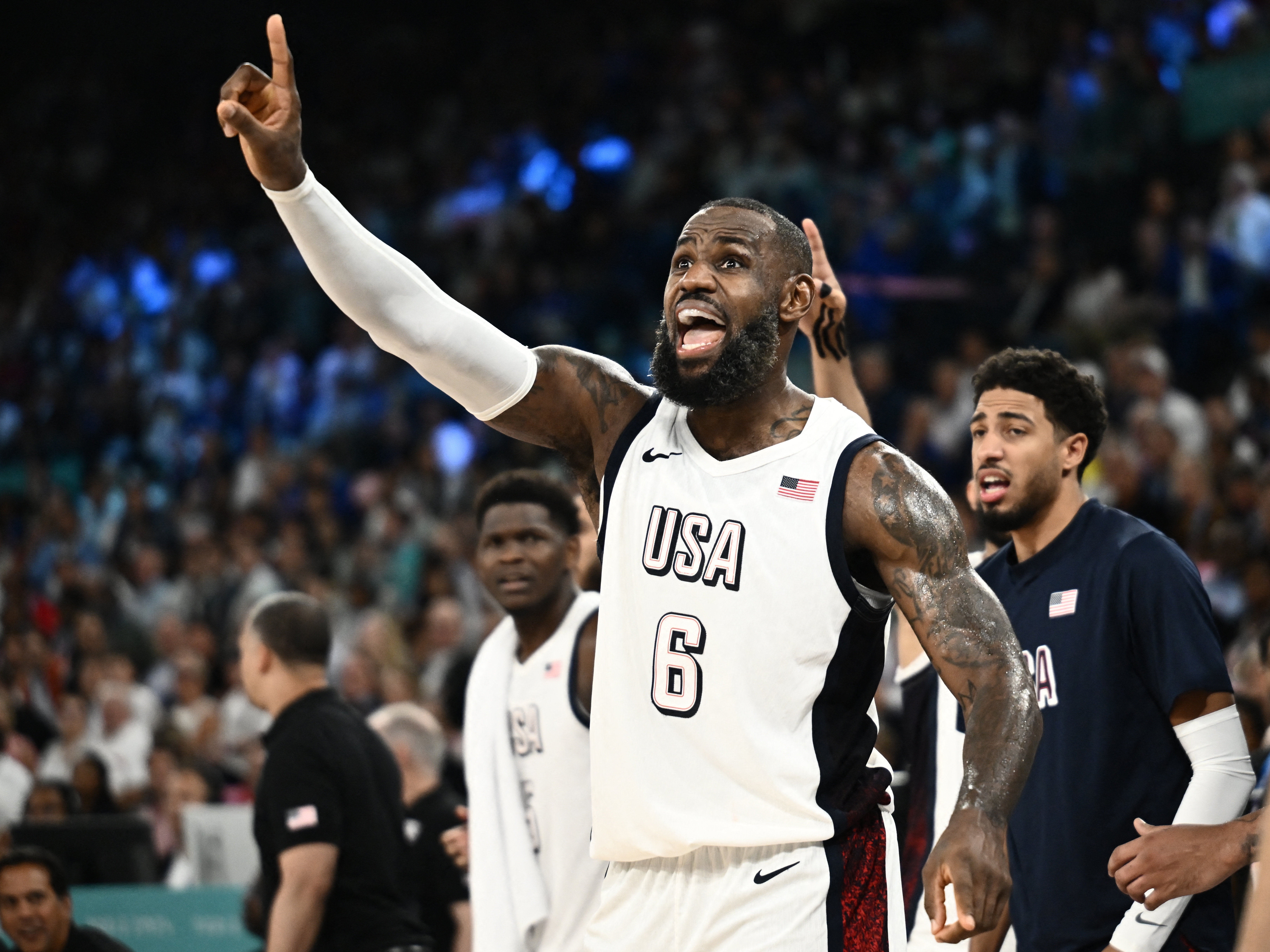 caption: USA's LeBron James reacts during the men's semifinal basketball game against Serbia during the Paris 2024 Olympic Games at Bercy Arena on Thursday. The U.S. trailed Serbia most of the game but won 95-91.