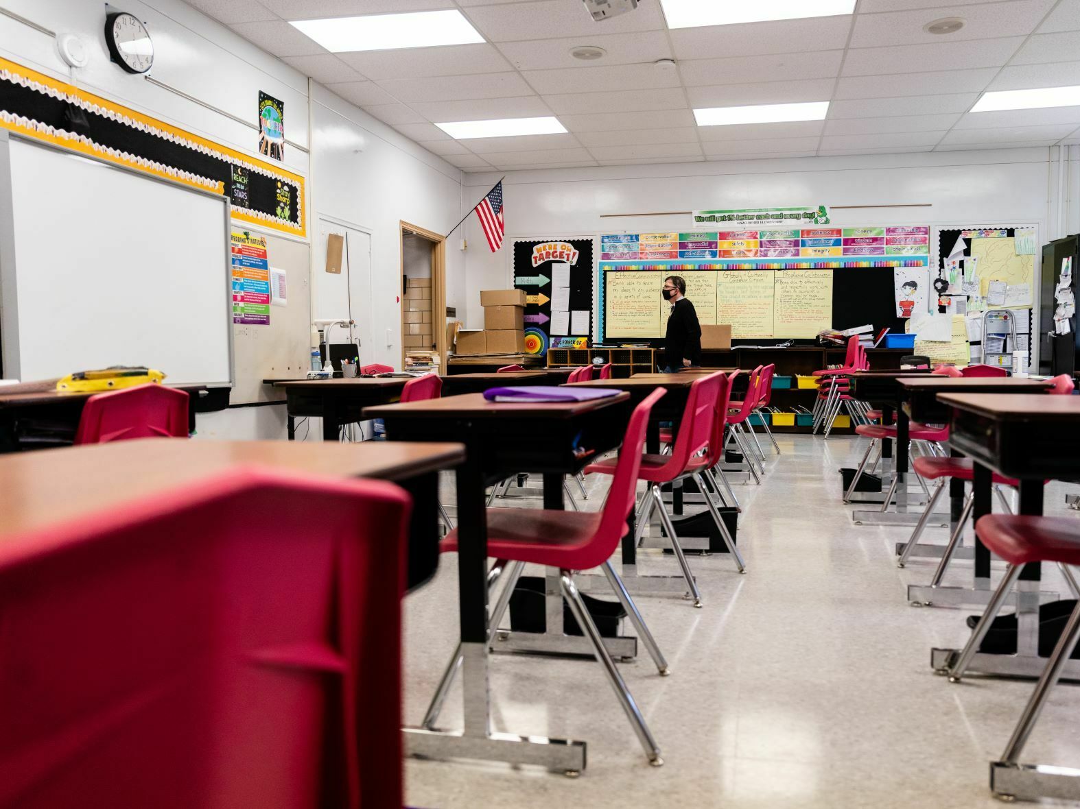 caption: A Louisville, Ky., classroom sits empty in January 2022, during a COVID surge driven by the omicron variant. Students lost the routine of going to school during the pandemic, and now many are struggling to get back in the habit.