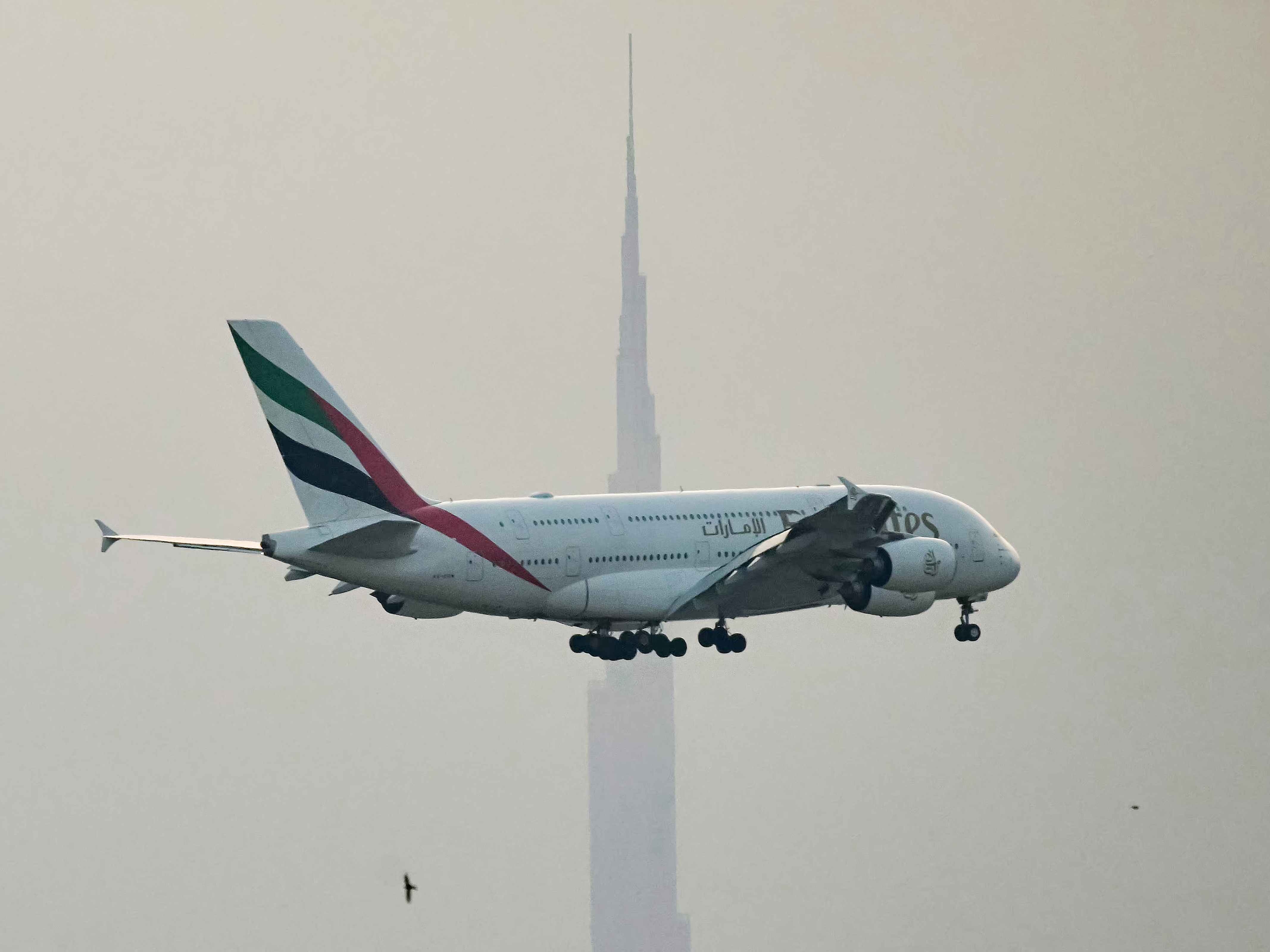 caption: The U.S. and other nations have agreed to tap into oil reserves, but the move might not do much to bring jet fuel prices down rapidly, an expert tells NPR. It's one way violence in the Middle East can affect flights around the world. Here, an Emirates airliner prepares to land at Dubai's main airport on Sunday.