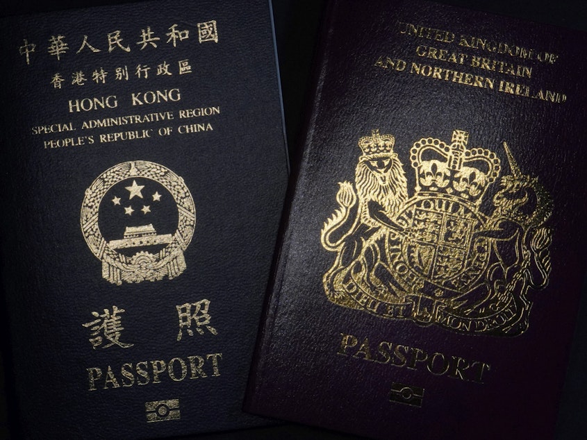 caption: A British National Overseas passport (right) and China's Hong Kong Special Administrative Region passport. China said Friday it will no longer recognize the BNO passport as a valid travel document or form of identification.