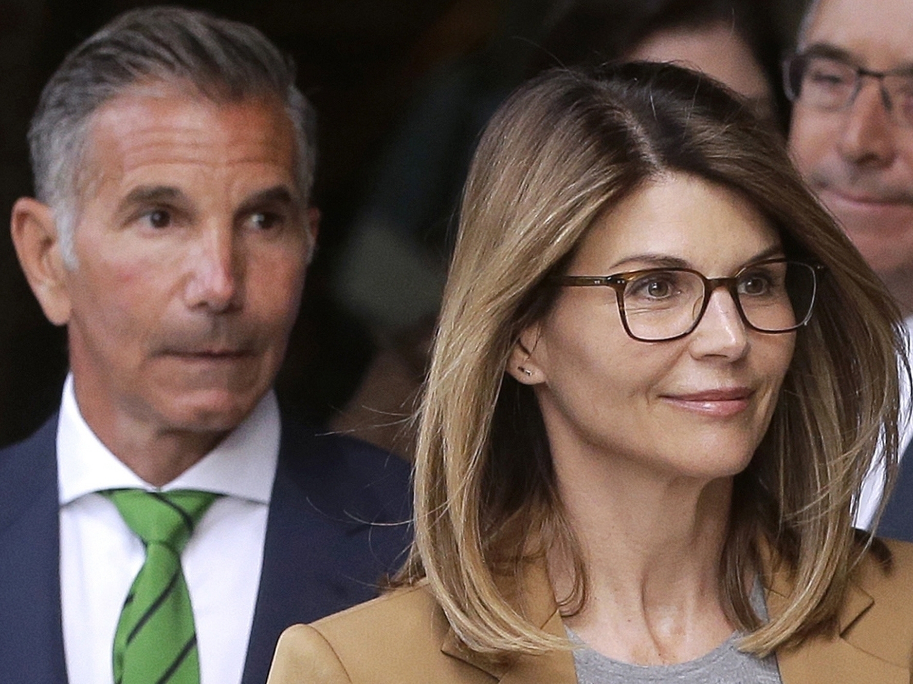 caption: Actress Lori Loughlin and her husband, clothing designer Mossimo Giannulli, have agreed to plead guilty to charges from a nationwide college admissions bribery scandal.