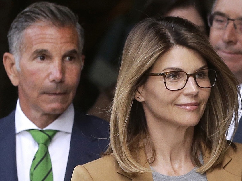 caption: Actress Lori Loughlin and her husband, clothing designer Mossimo Giannulli, have agreed to plead guilty to charges from a nationwide college admissions bribery scandal.